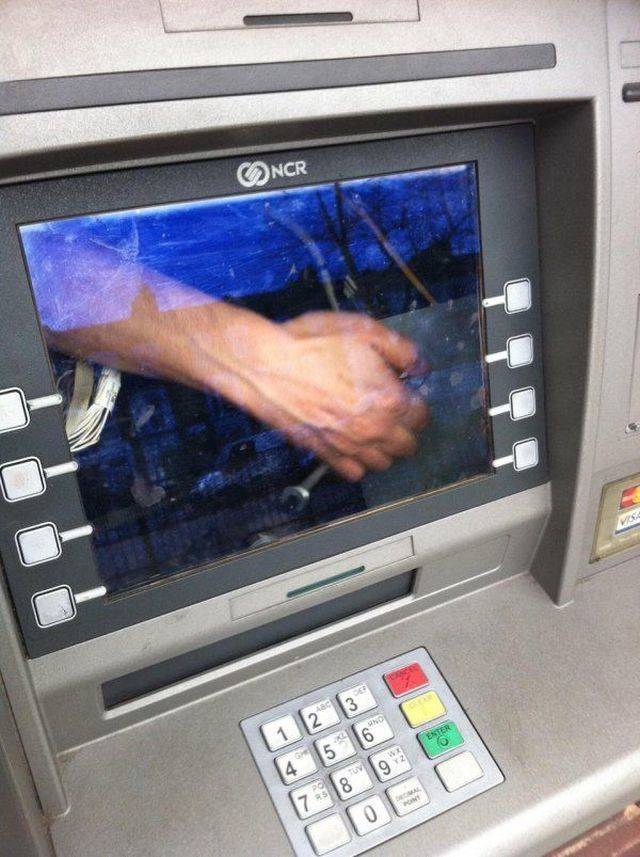 technician inside an ATM