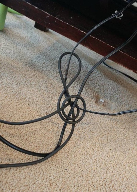 random picture of an electric cord twisted like a musical note
