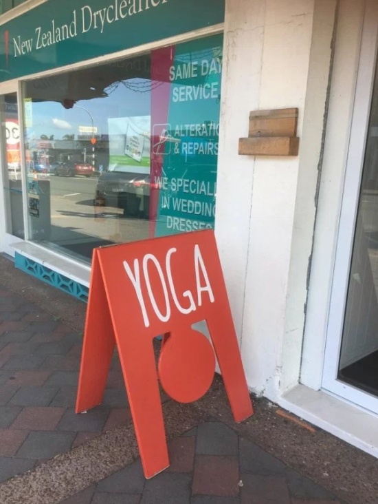 funny picture of a sign that looks like a person in a yoga pose