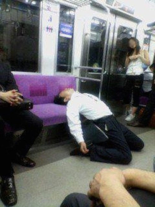 japanese man sleeping on train - Am