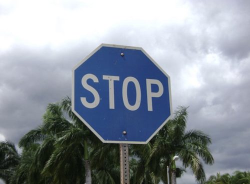 blue stop sign - Stop
