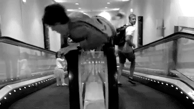 kid is on the escalator again gif