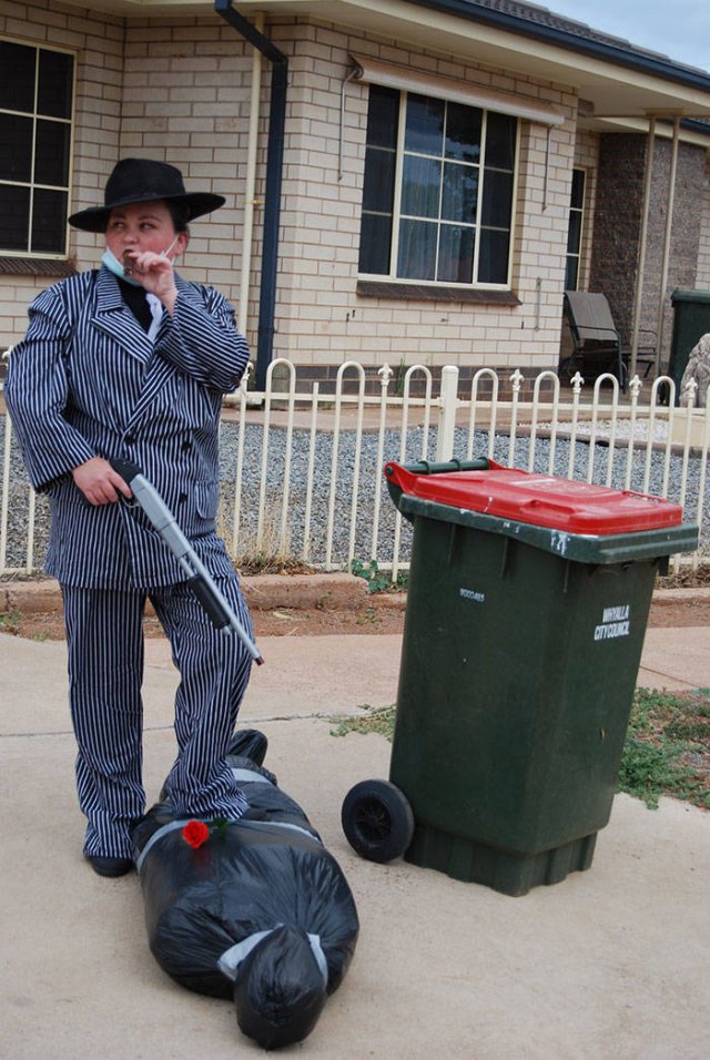 old timey gangster with a trashcan
