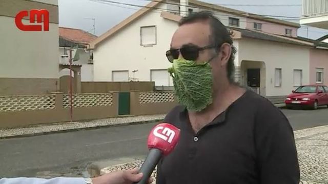 man wearing cabbage leaf as face mask