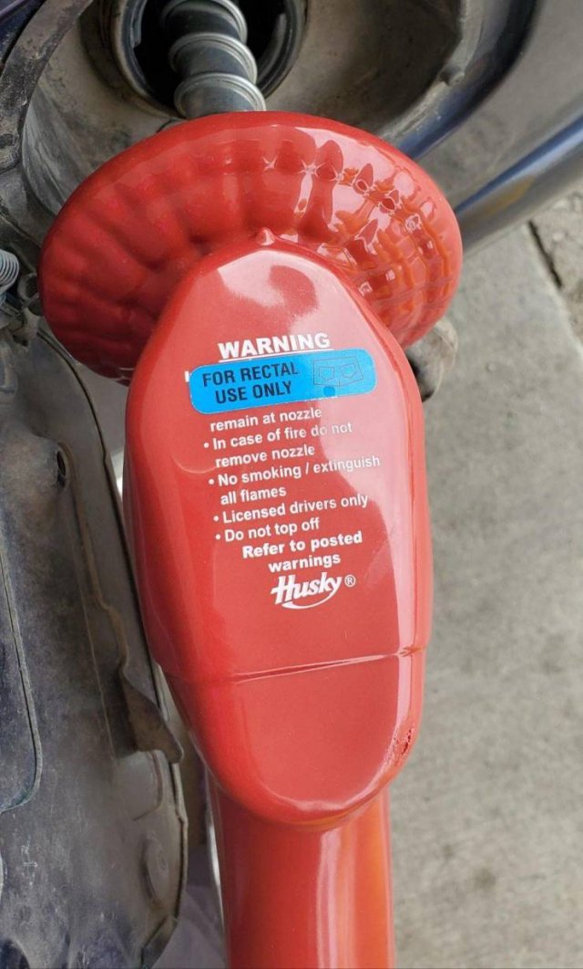 orange - Warning For Rectal Use Only remain at nozzle In case of fire do not remove nozzle No smoking extinguish all flames Licensed drivers only Do not top off Refer to posted warnings Husky