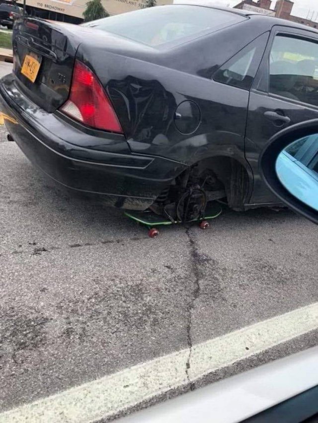 car entirely missing a wheel
