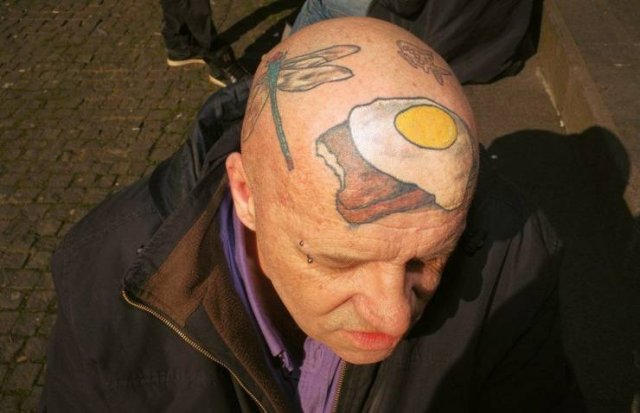 egg tattoo on head