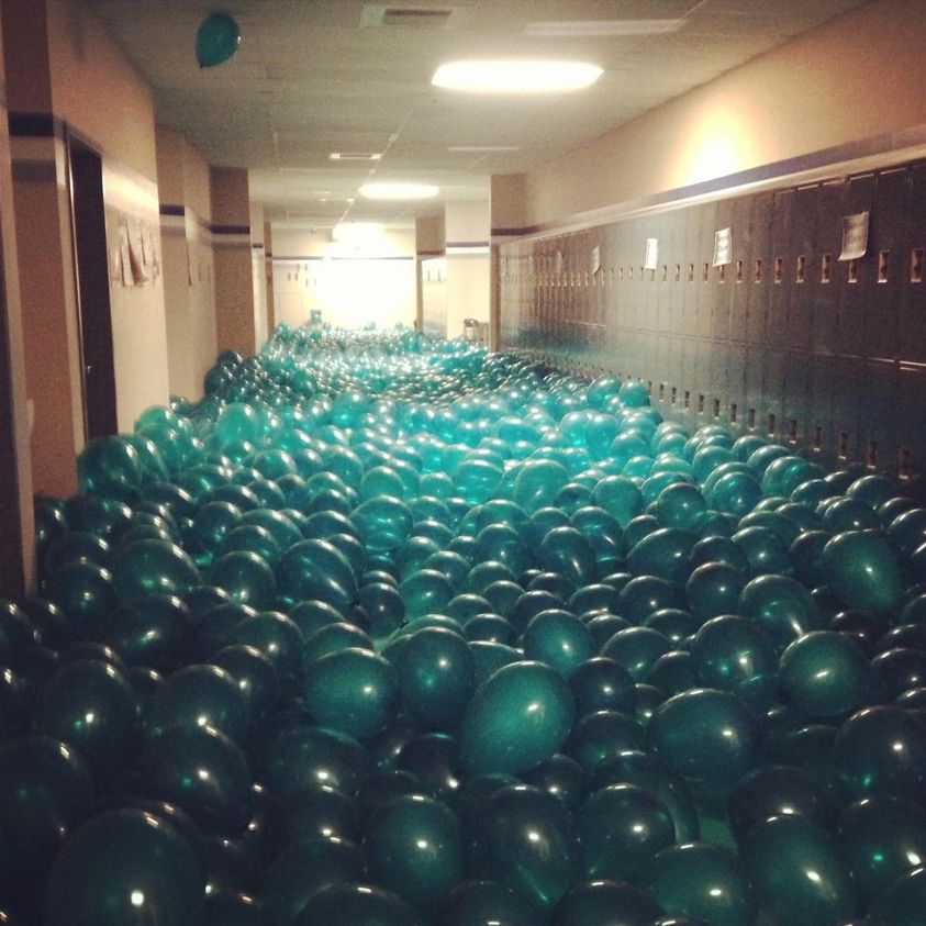 school hallway filled with balloons