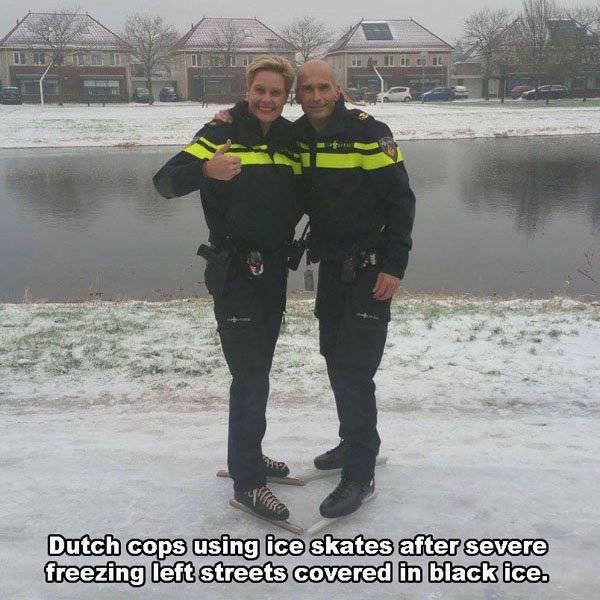 vehicle - 2 sikia Dutch cops using ice skates after severe freezing left streets covered in black ice.