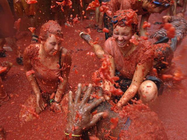 The biggest food fight in the world, La Tomatina, attracts around 30,000 people to Buñol, Spain, to party and hurl tomatoes at each other every August.