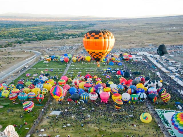 The Albuquerque International Balloon Fiesta is the world's largest hot-air-ballooning event. Crowds gather for nine days in October as hundreds of balloons fly over the Sandia Mountains.