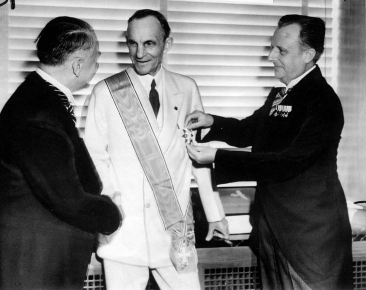 Henry Ford receiving the Grand Cross of the German Eagle from Nazi officials, 1938