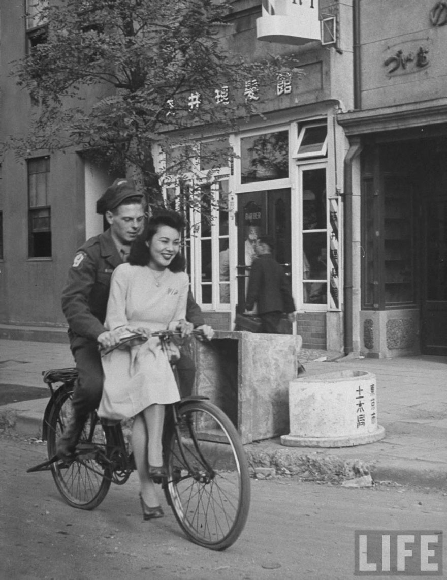 US Soldier Giving Japanese Girl A Bicycle Ride, With Handlebar Riding Forbidden, 1946, Japan