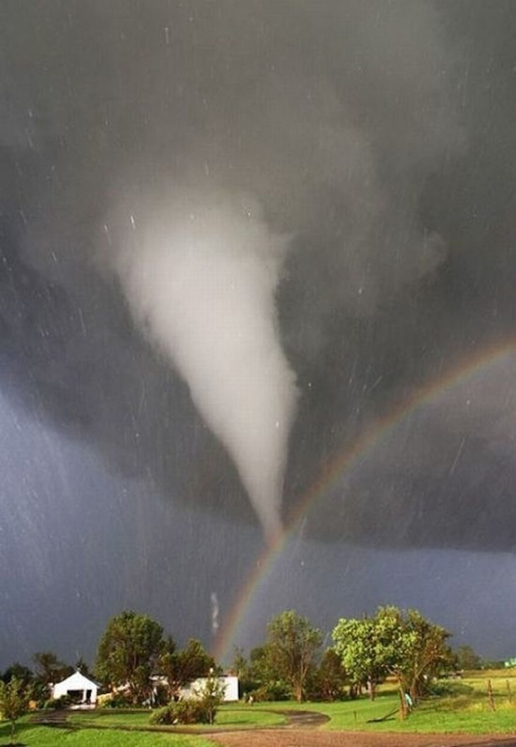 A tornado and rainbow converge over Kansas.
