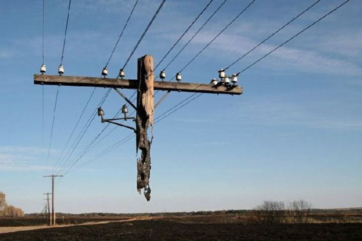 No optical illusion here, it’s just part of a phone line that has been destroyed by a fire in Russia.