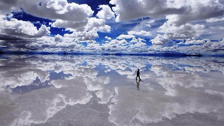 The giant salt flats in Bolivia make it appear as if you are walking on water.