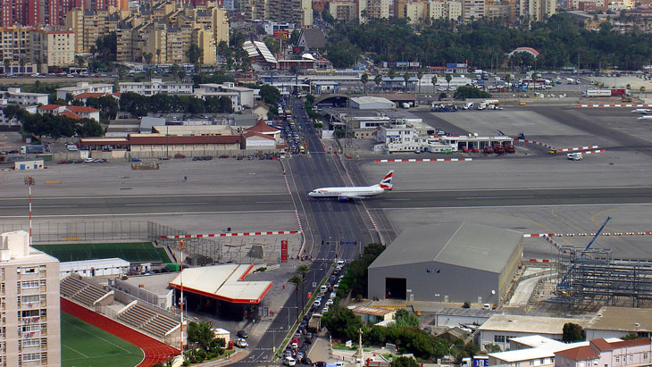 A regular road crossing through the runway of the Gibraltar International Airport.