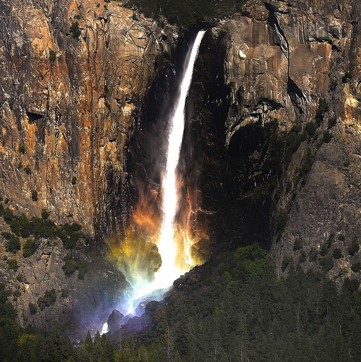A perfect timed photo: When a rainbow hit this spectacular waterfall.