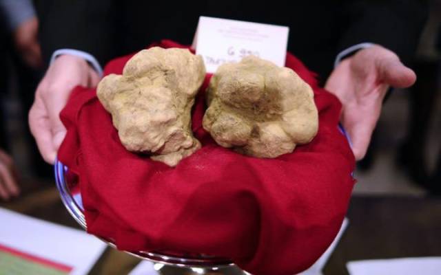 White truffle: $325 per gram
In 2010, the most expensive Alba white truffle ever sold, weighing 1.3kg, went to Macau billionaire Stanley Ho for $417,200, meaning he paid $325 per gram. 
However, presumably less superior Alba white truffles can be bought for around $4 per gram.