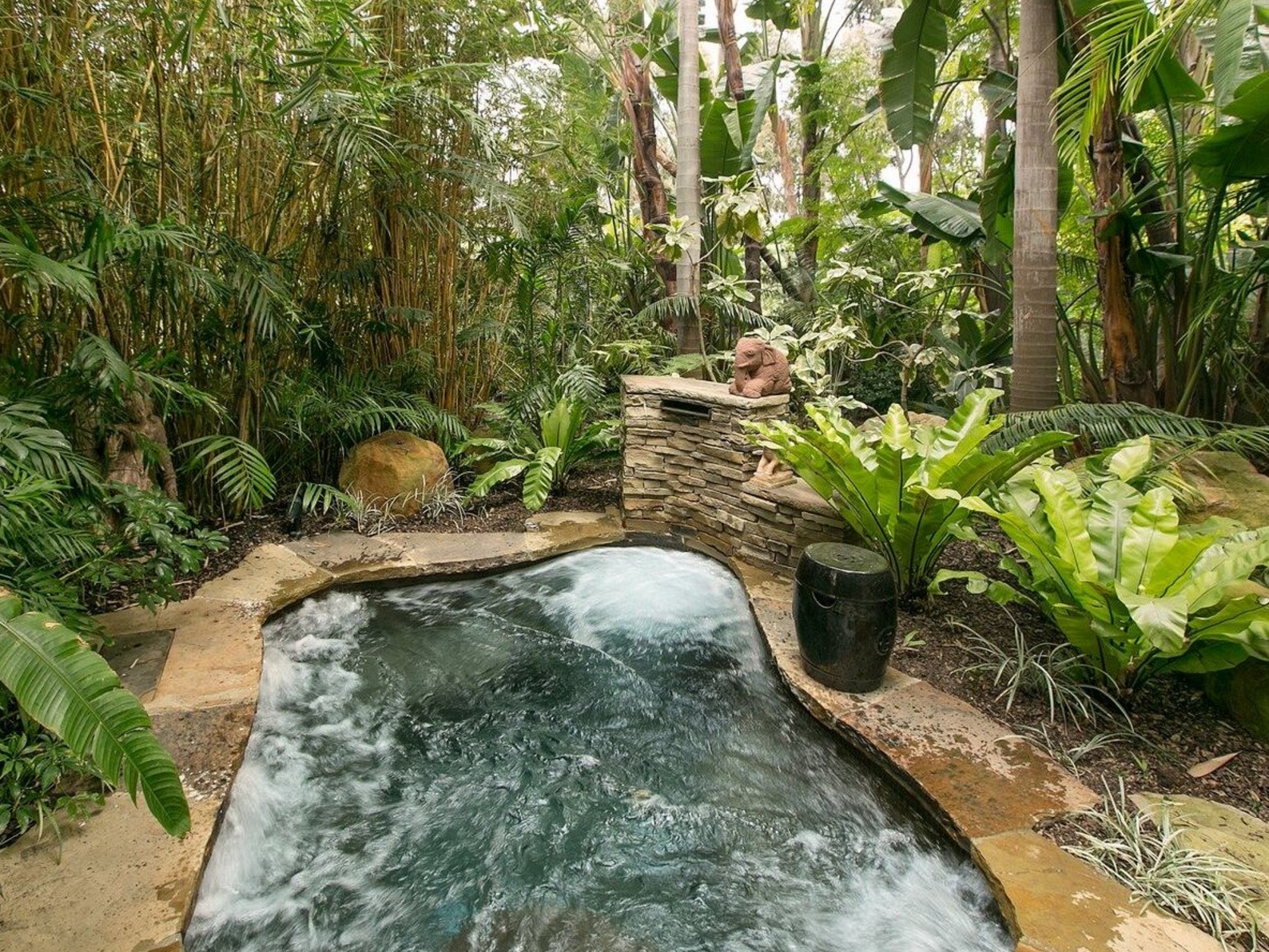 There is also a stone Jacuzzi nestled in the garden.