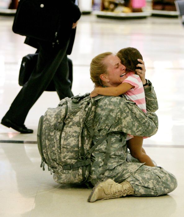 Soldier returns home from war.