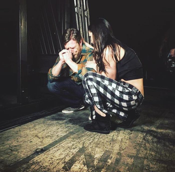 WWE’s Daniel Bryan and his wife backstage moments after he announces his early retirement due to injury.