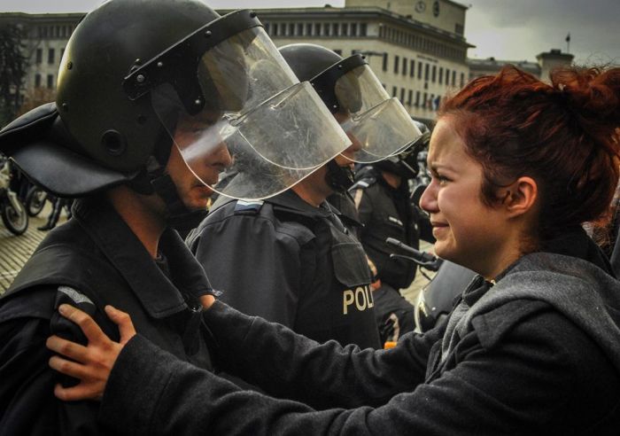 Riot police and student both crying about corruption and poverty in Bulgaria.