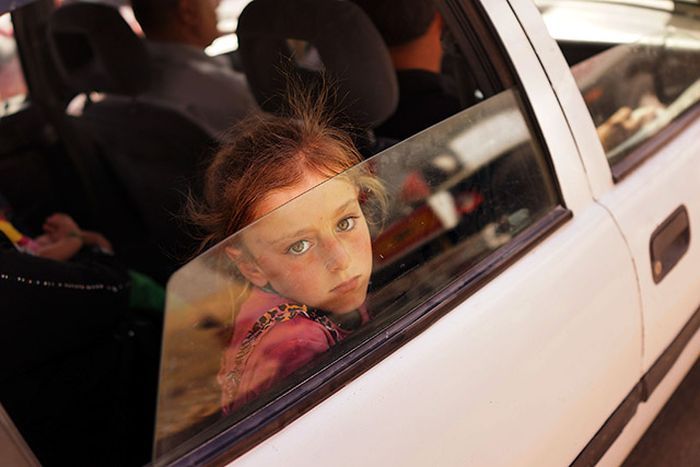 An Iraqi girl fleeing from the ISIS.