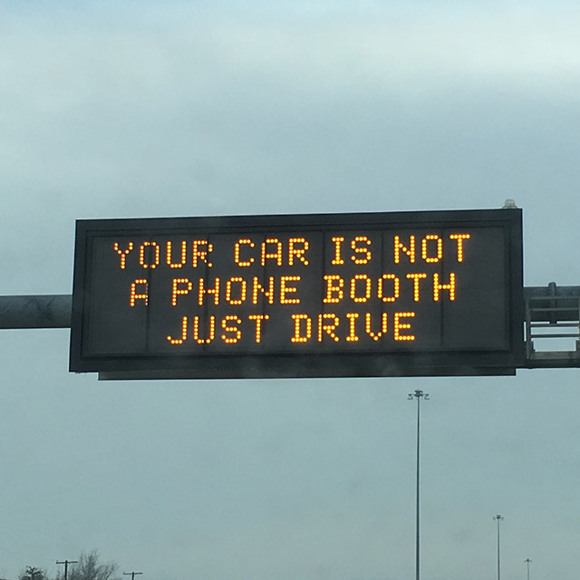 sign - Your Car Is Not 'A Phone Booth Just Drive