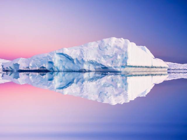 Navigate through icebergs on a cruise to Antarctica.
