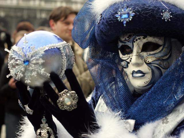 Wear a mask at Carnival in Venice, Italy.