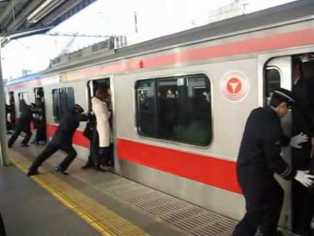 Train Pushers: “There are people in Japan whose job is to stuff people into trains to make space for the doors to close during rush times.”