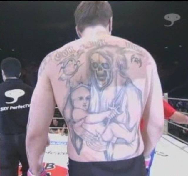 Alexander Emelianenko has the most sinister tattoo in all of MMA…Grim Reaper holding a baby