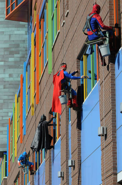 Workers from Memphis Cleaning Company dress up as superheroes to cheer up patients at children's hospitals.