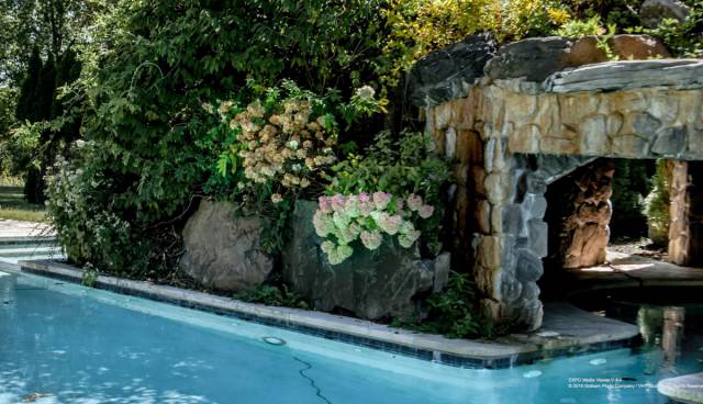 And this pool with a stone archway and surrounding foliage has likely hosted more than a few extravagant pool parties.