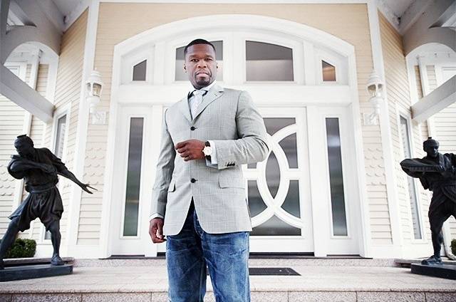Here he is posing in front of the mansion's front door ...