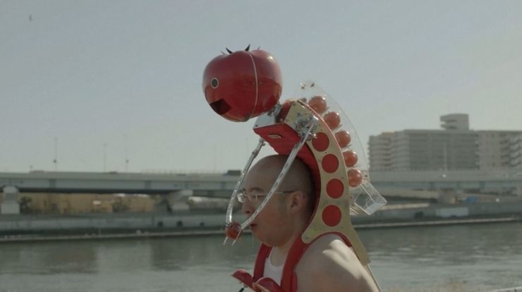 WEARABLE TOMATO ROBOT: Meet Tomatan, a wearable robot that feeds you tomatoes as you run. Looks like this robot will power you through a marathon.