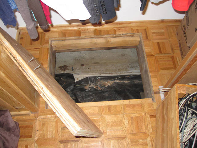 The trapdoor opened easy but it looked like there was nothing but dust to be found down there.