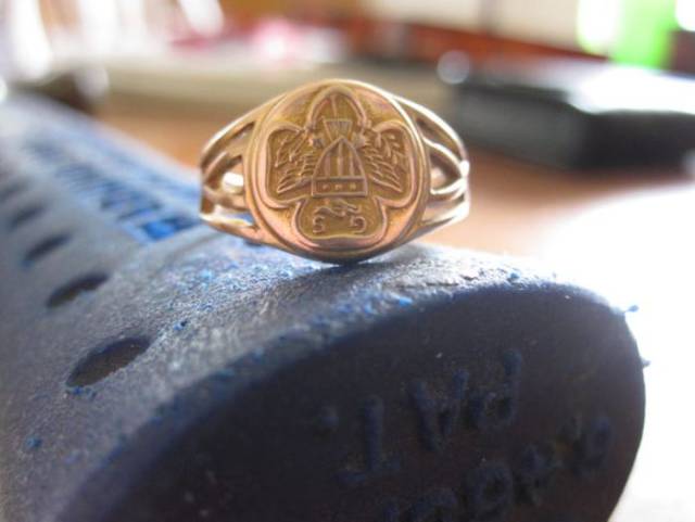 This ring with the old Girl Scout logo was also in the tiny box.
