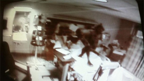 The Demon in a Hospital: This photo was taken by a nurse at an unknown hospital. It shows what looks like a demon hovering above a patient. The patient allegedly died shortly thereafter.
