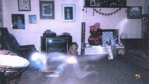 The Mother Who Passed Away: This photo taken by the little girl’s father has made the rounds on the internet. Many have speculated that the ghostly figure is the child’s late mother playing with her.