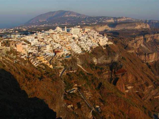 The beautiful buildings in Fira almost look out of place on the cliff.