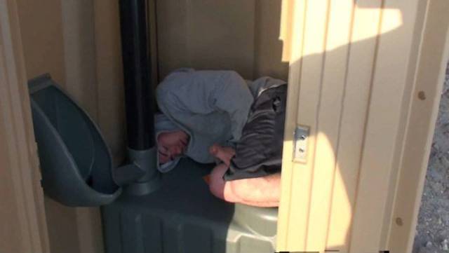 passed out in porta potty