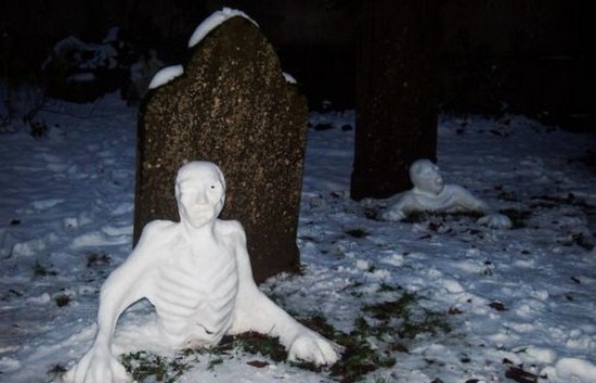 scary snow man in a graveyard that looks like corpses crawling out of their graves.