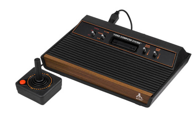 1979: The ATARI 2600 - The Atari Video Game Computer System was a home video game console that revolutionized the gaming industry thanks to its interchangeable cartridges. People could play multiple games on one system conveniently.