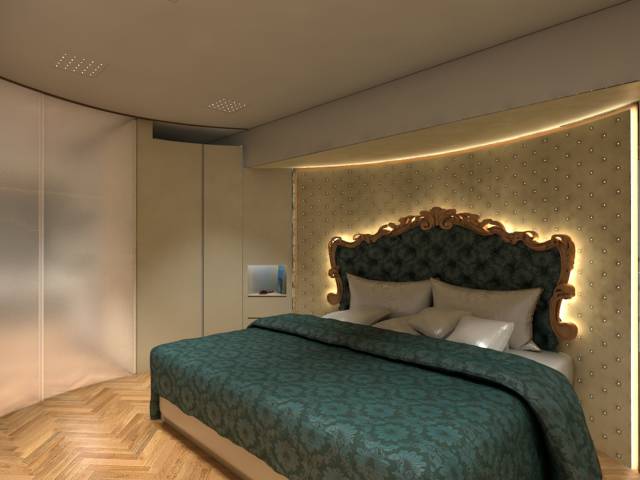 The master bedroom is spacious, not to mention glamorous. Just look at that intricate wooden headboard and tufted wall.