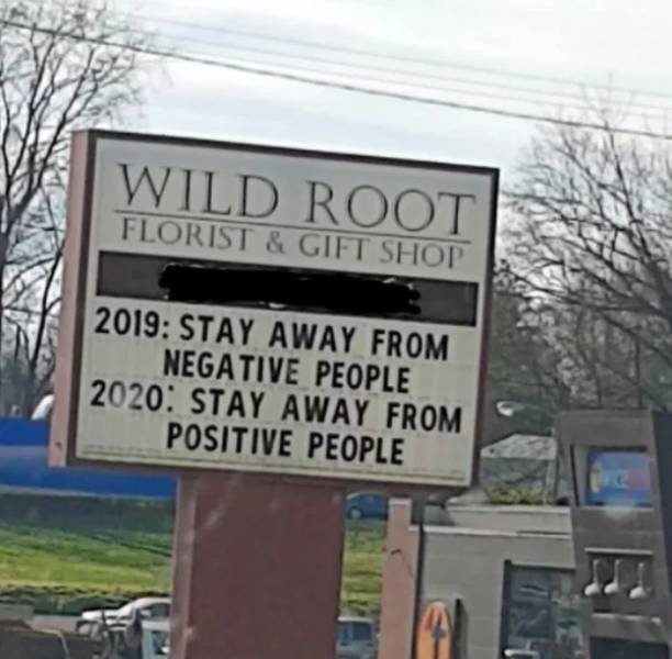 street sign - Wild Root Florist & Gift Shop 2019 Stay Away From Negative People 2020 Stay Away From Positive People