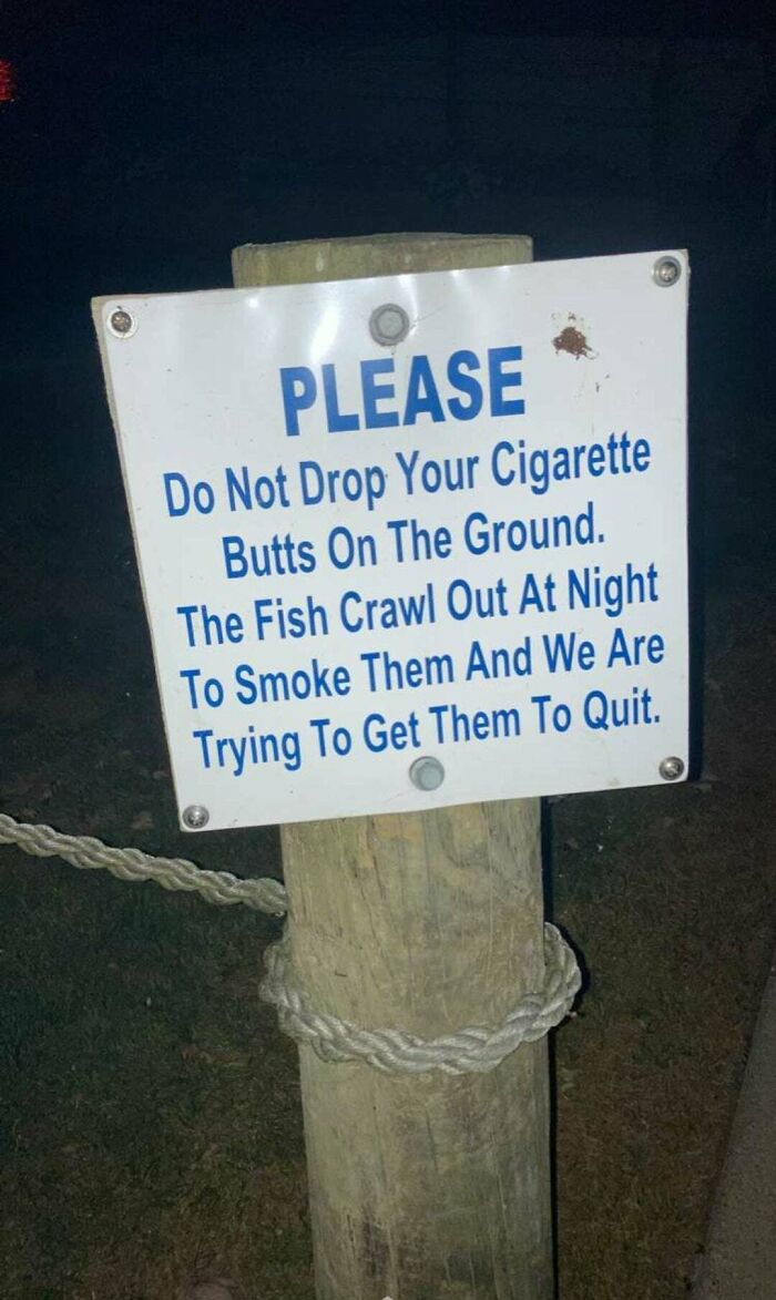 sign - Please Do Not Drop Your Cigarette Butts On The Ground. The Fish Crawl Out At Night To Smoke Them And We Are Trying To Get Them To Quit.