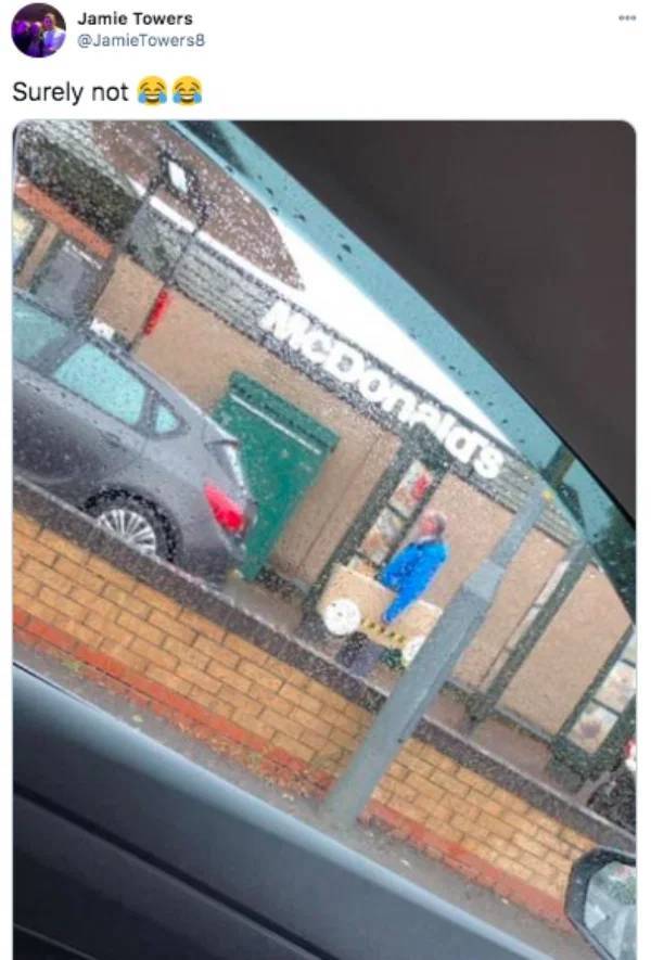 man in cardboard car drive through - Jamie Towers Surely not McDonalds
