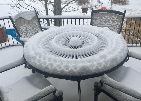 “This pattern in the snow on a patio table.”